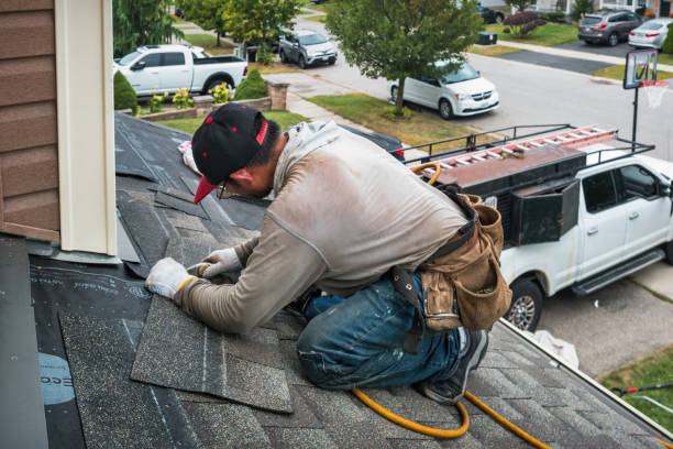 Professional Roofing technician working in Clio, IA